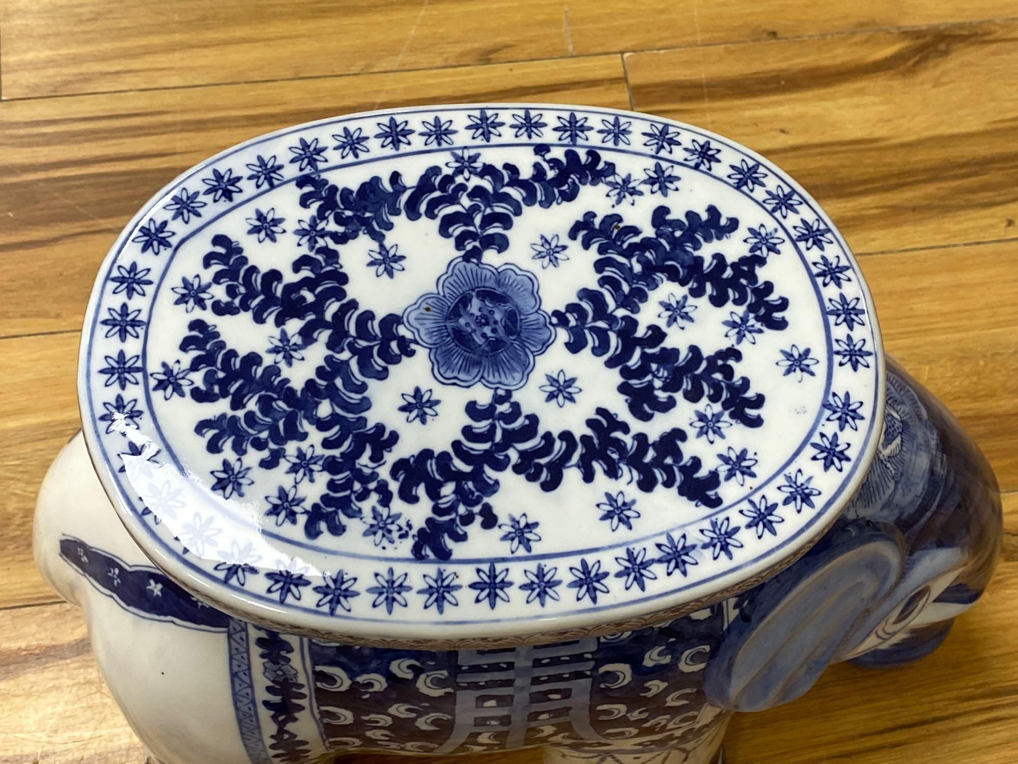 A Chinese blue and white ceramic garden seat and a similar elephant seat, 47.5cm tall